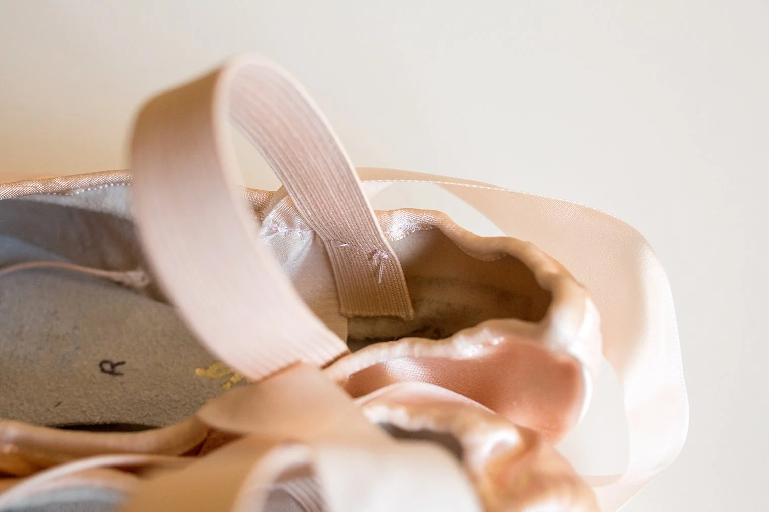 How to sew elastic bands onto ballet shoes tutorial DanceMaster NET